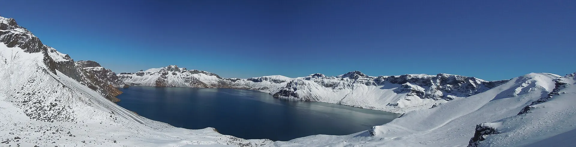 Panorama of Tianchi crater lake at Changbai Mountain under a clear sky